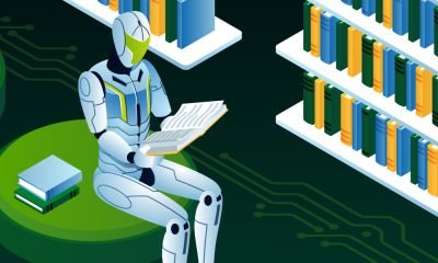 An illustration of a robot reading a book in a library